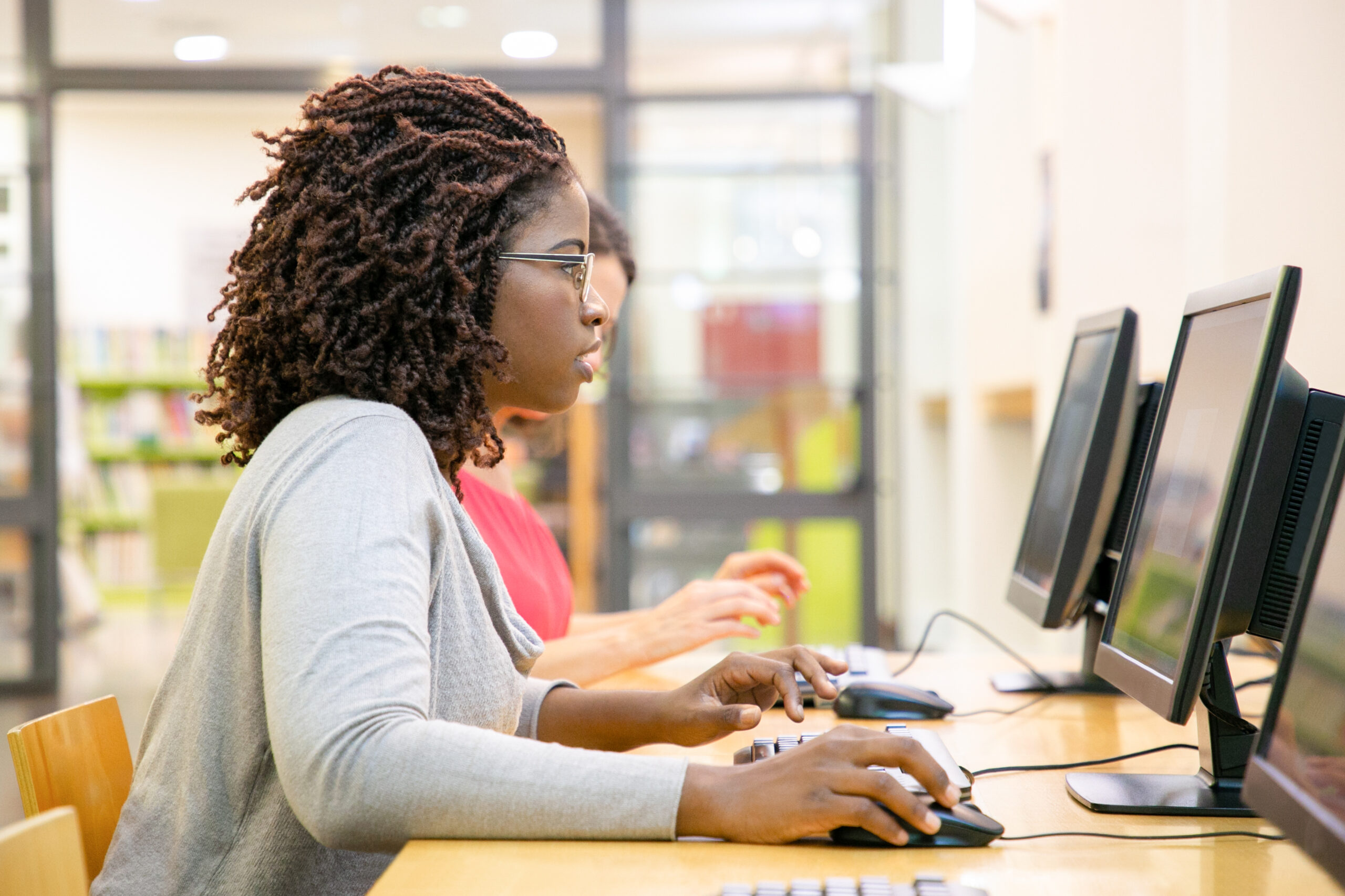 Focused female student excited with online test