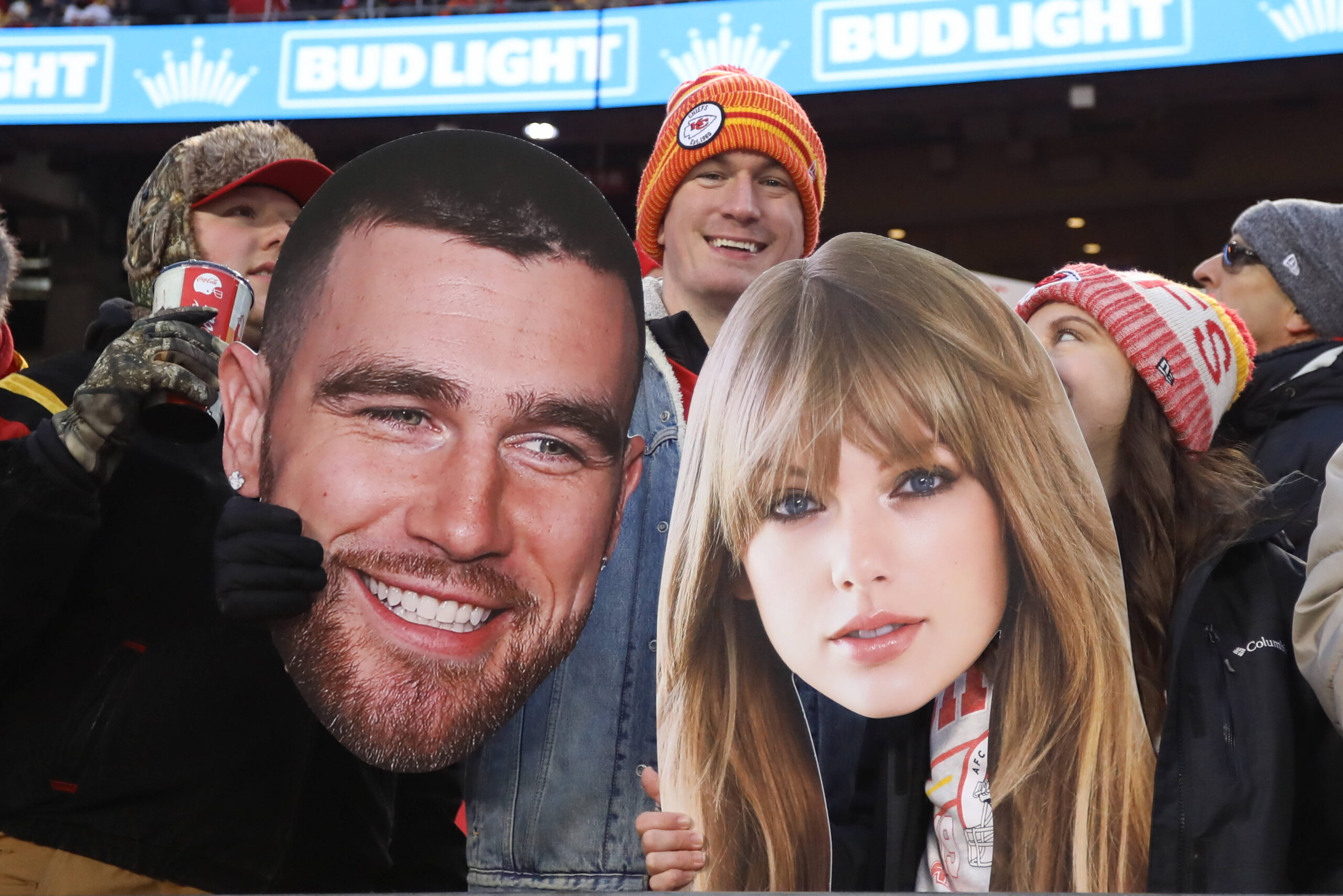 KANSAS CITY, MO - DECEMBER 31: Fans hold large pictures of Travis Kielce and Taylor Swift during an NFL, American Footba